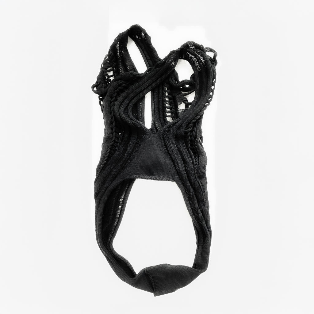 Black lace garment on a white background